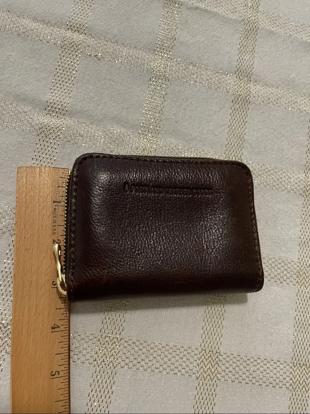 Portland Leather Goods brown wallet, gold tone zipper, inside holds coins/cards